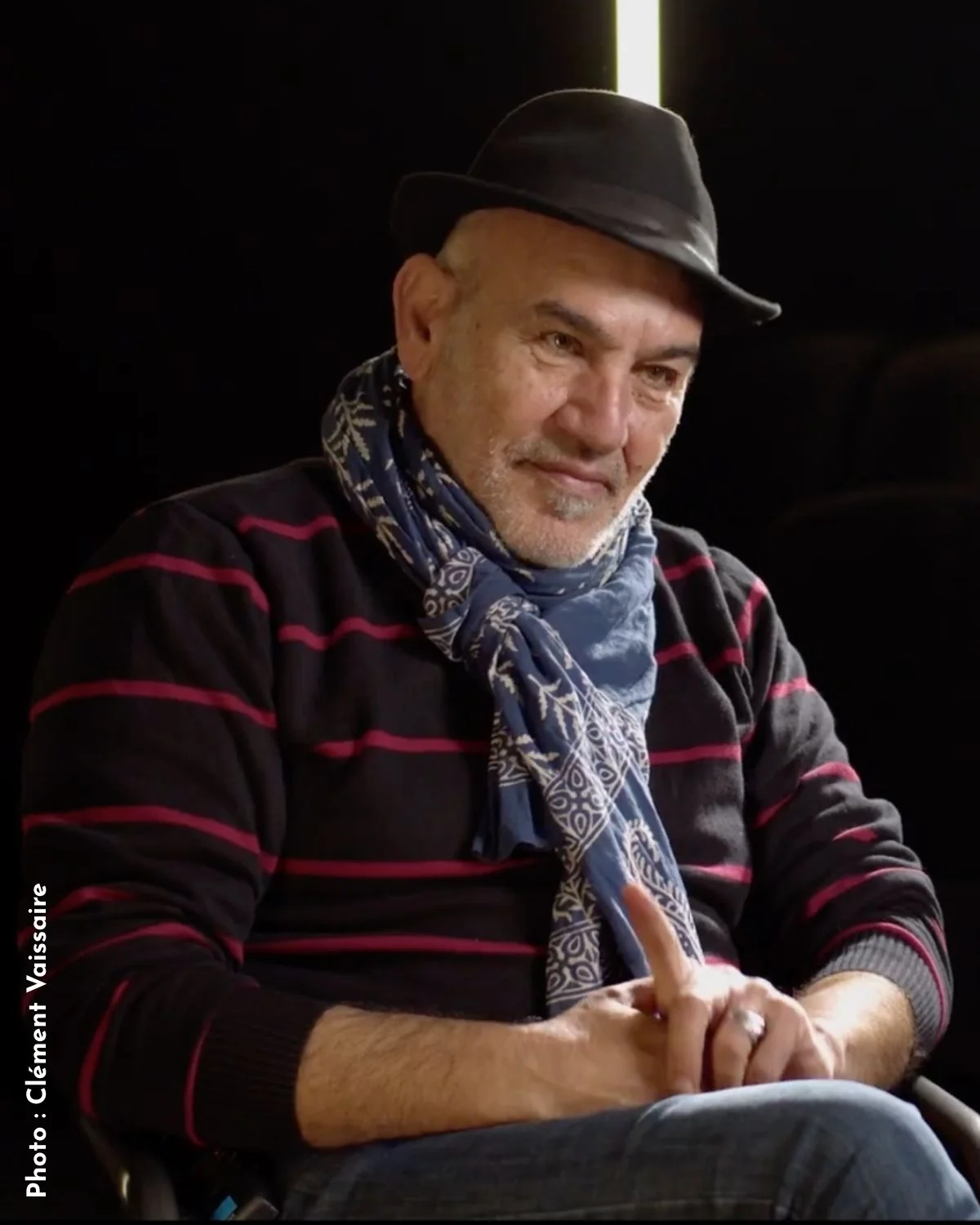 Rashid Masharawi seated in a cinema. Photo: Clement Vaissaire